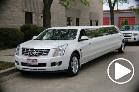 White Cadillac SUV stretch limousine parked in Milwaukee for luxury event travel.